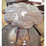 A 30.5cm Raj period Anglo-Indian carved hardwood two tier occasional table with profuse floral