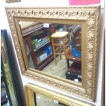 A 68cm X 59cm 20th Century carved giltwood framed oblong wall mirror