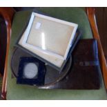 A small selection of vintage photo frames including leather, velvet and metal examples