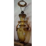 A vintage Venetian blown glass table lamp with applied handles, prunties and ribbon trailing