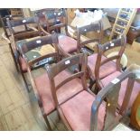 A set of six mahogany framed sabre leg dining chairs with remains of brass stringing and drop-in