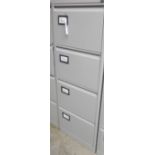 A modern four drawer grey painted filing cabinet - with key