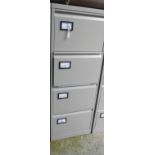 A modern four drawer grey painted filing cabinet - with key