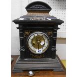 A late 19th Century German stained wood cased mantle clock with scale effect pediment and HAC