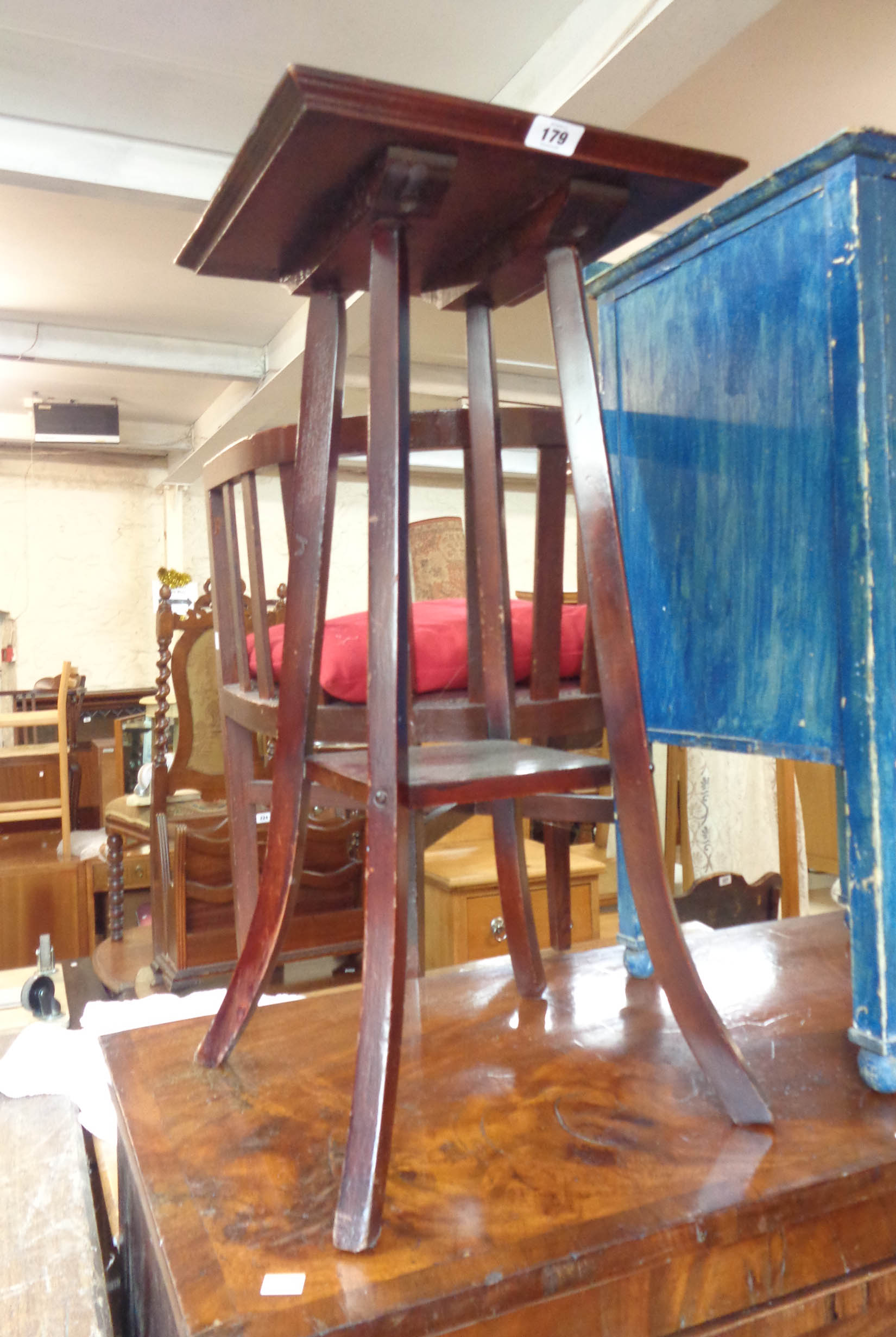 A 35cm stained wood two tier occasional table, set on swept supports