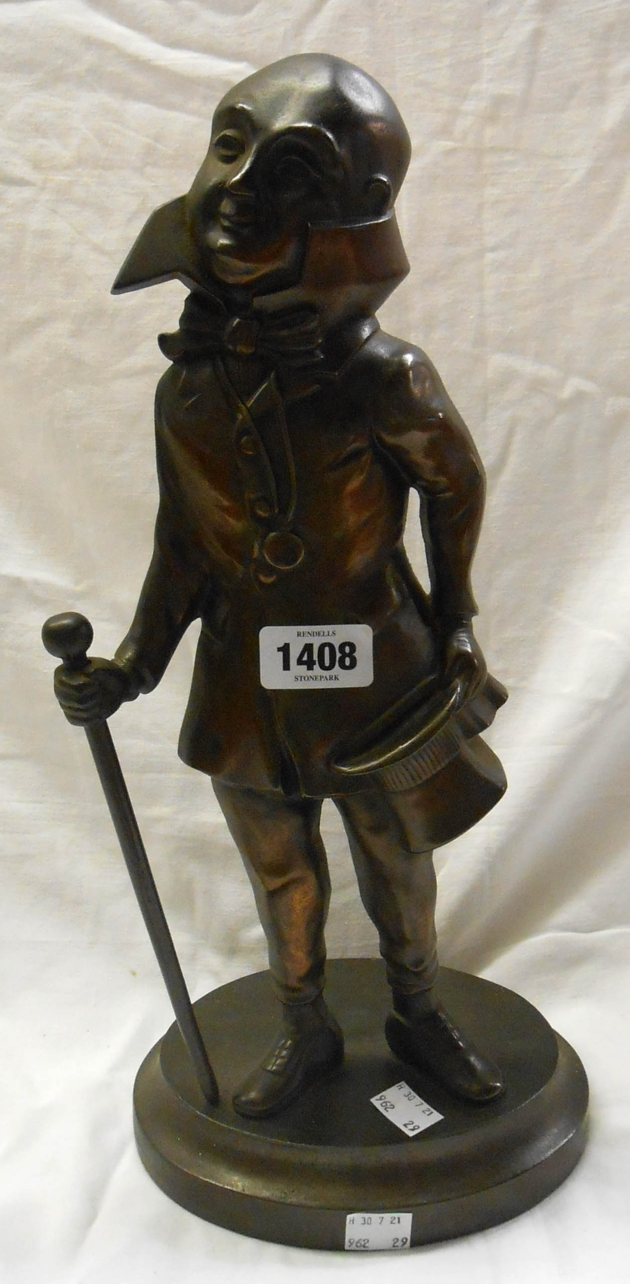 A vintage cast iron with bronze finish doorstop featuring Mr Micawber from David Copperfield