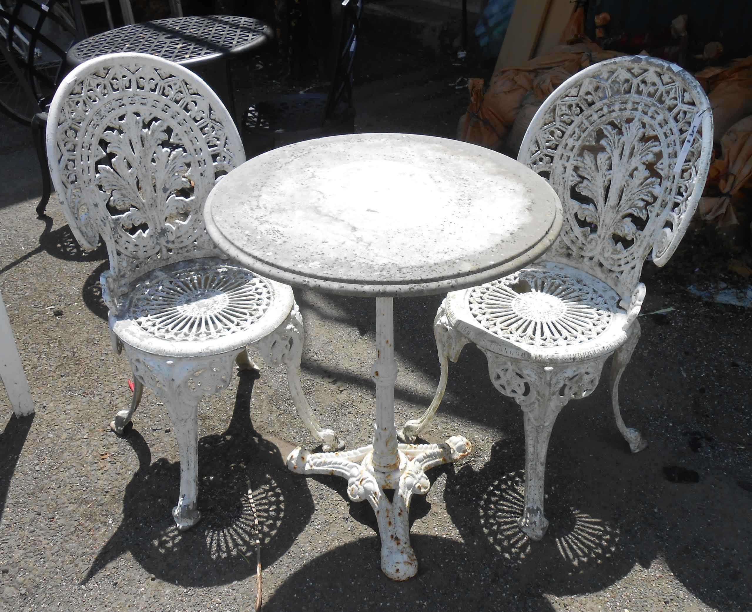 A marble top cast iron pedestal garden table - sold with two painted aluminium garden chairs - 1