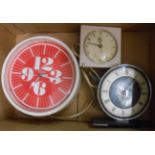 Two vintage electric timepieces and a battery wall clock