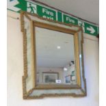 A late Victorian stepped frame wall mirror with decorative marbled glass border and bevelled