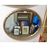 A vintage gilt framed bevelled circular wall mirror