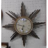 A vintage Selva Electra brassed metal sunburst wall timepiece