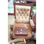 A late Victorian walnut part show frame drawing room armchair with incised decoration and button