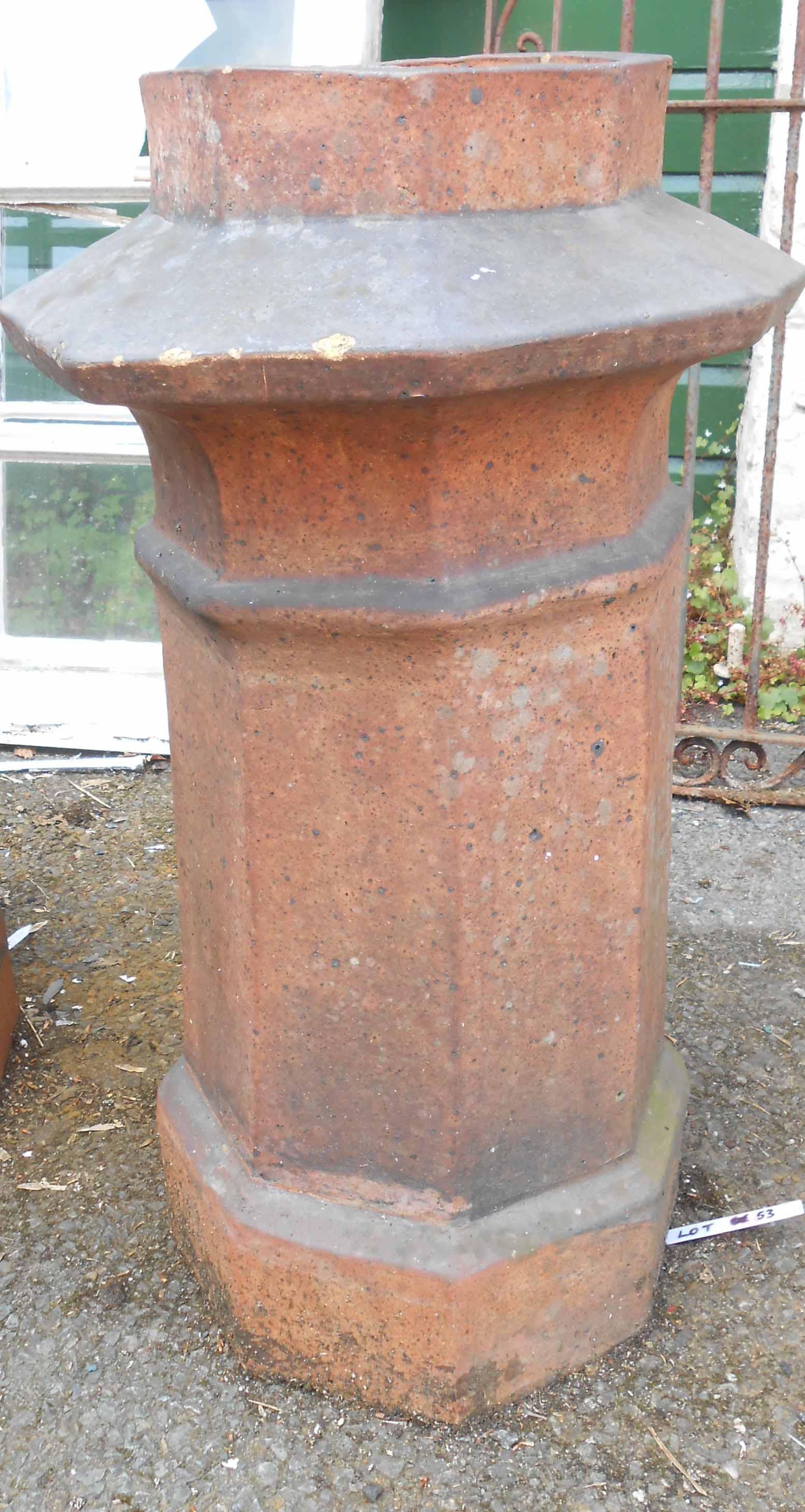 A large salt glazed stoneware chimney pot of pagoda form