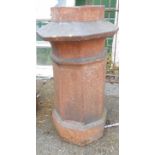 A large salt glazed stoneware chimney pot of pagoda form