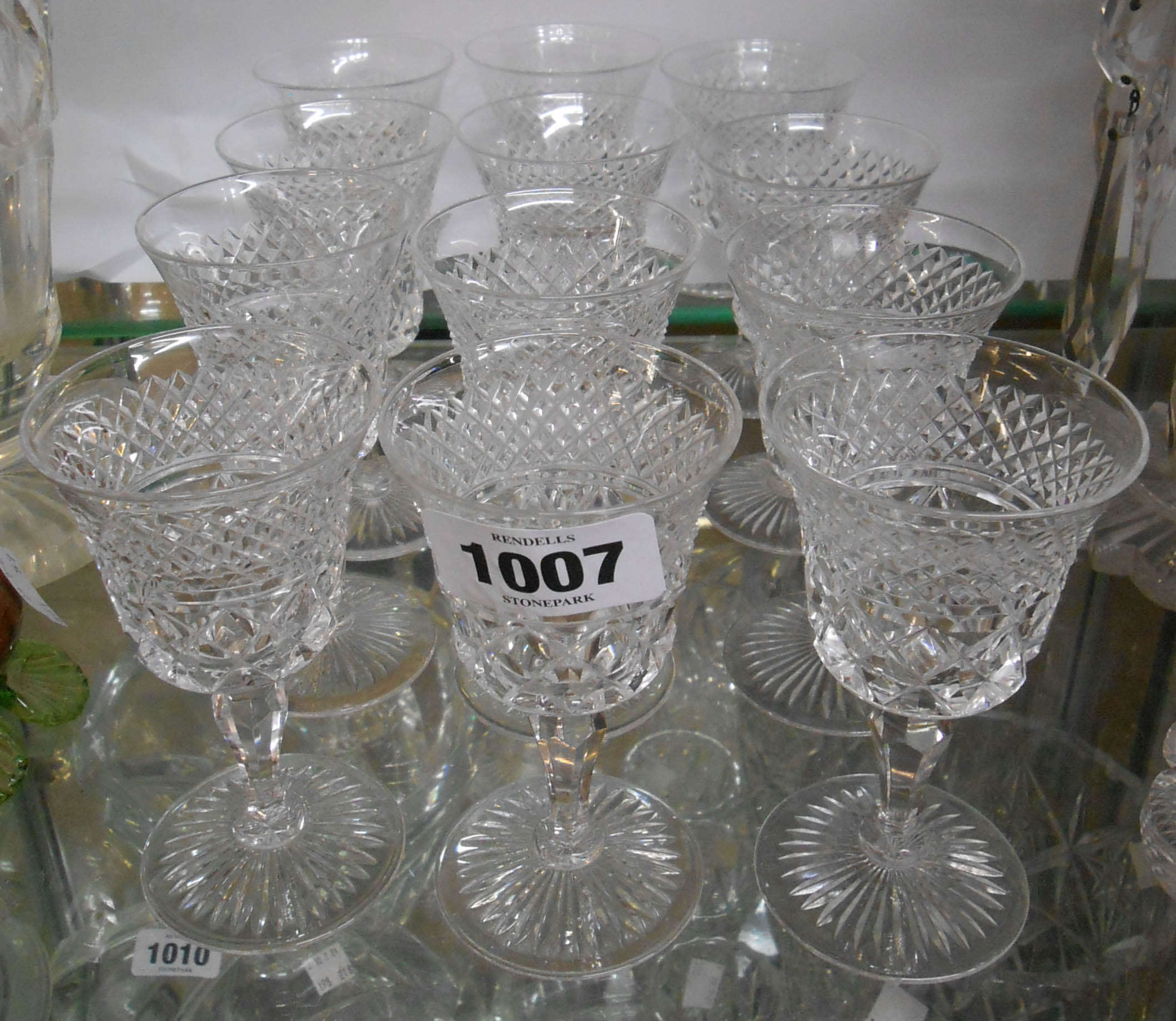 A set of six vintage Stuart crystal port glasses with heavily cut decoration - sold with a similar