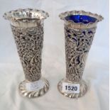 A pair of 16cm high ornate Sheffield silver trumpet vases with pierced and embossed decoration,