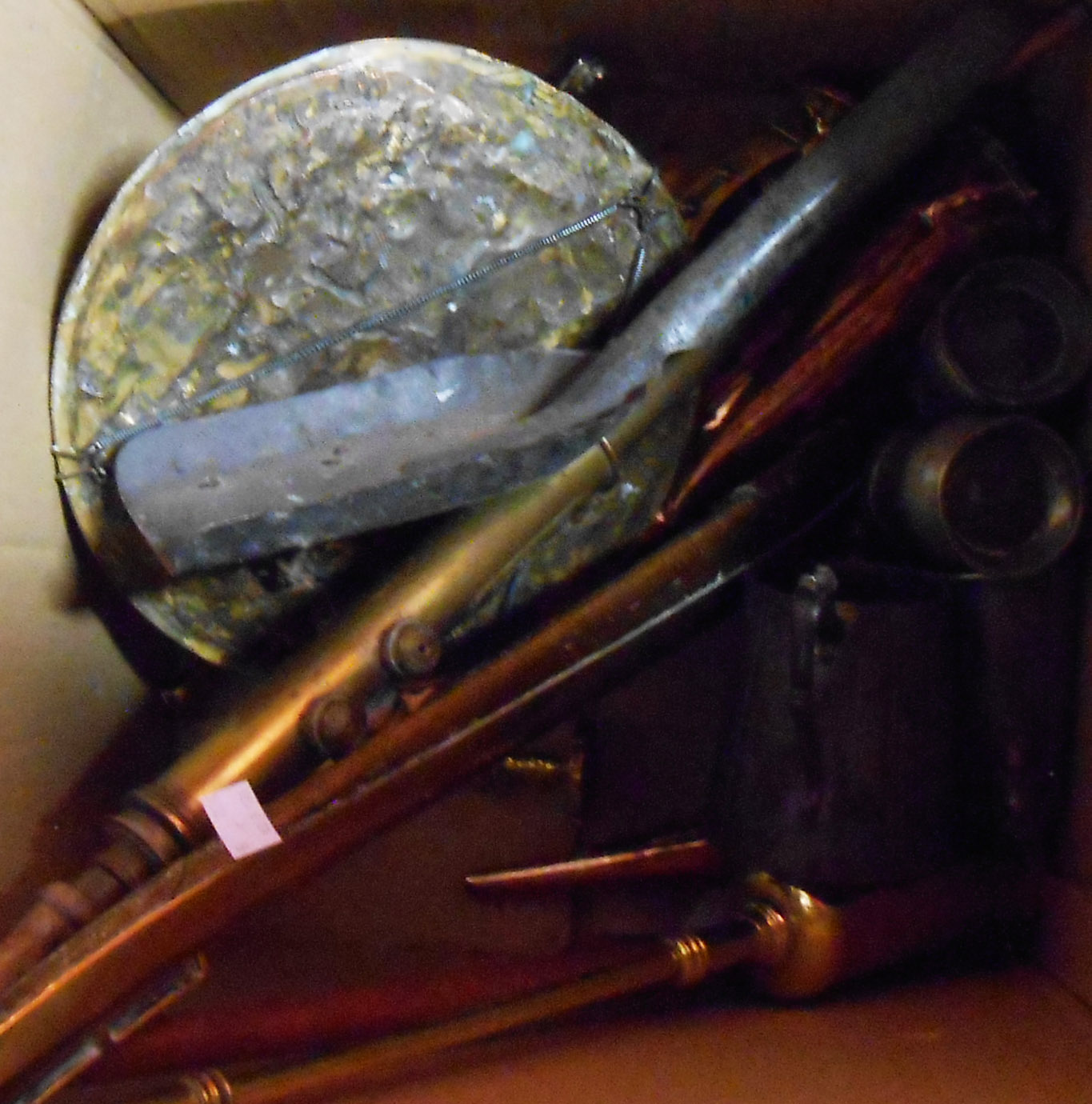 A box containing assorted metalware including copper kettle, hunting horns, pewter measures, etc.
