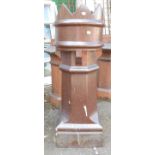 A large salt glazed stoneware chimney pot with castellated top