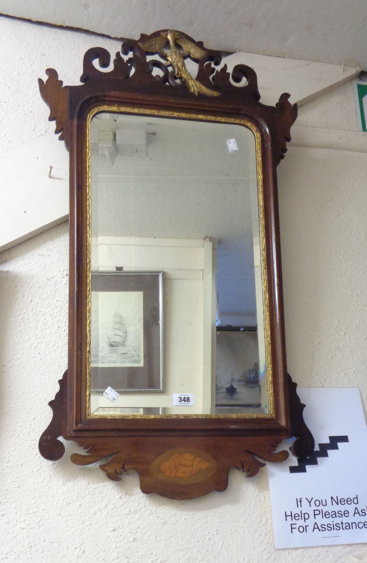 A restored late Georgian inlaid mahogany framed fret cut wall mirror with pierced and gilded bird