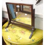 A 19th Century mahogany framed swing dressing table mirror with oblong plate, set on swept legs