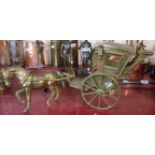 A large vintage cast brass model of a horse and carriage