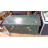 A 1.23m antique oak dome-top linen chest with painted floral decoration on green ground, text B.A.D.