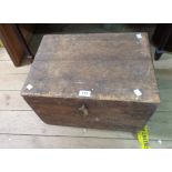 An antique pine tuck chest with flanking iron drop handles and key