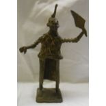 An African cast bronze figure depicting a man with horned headdress
