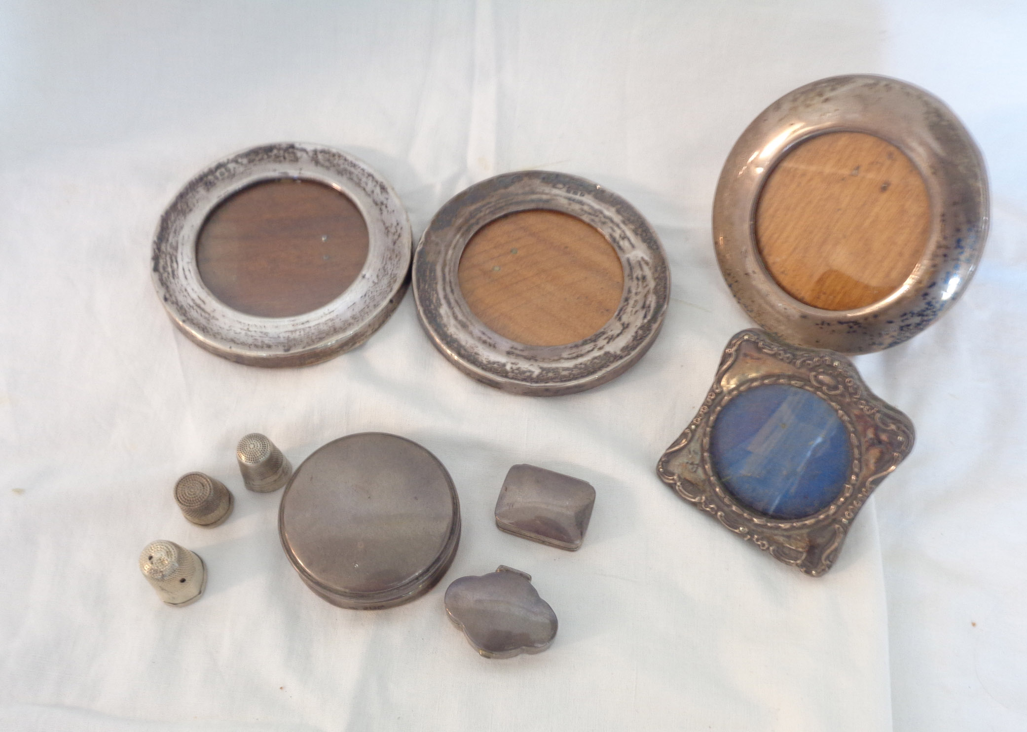 Two silver patch boxes, thimbles and small photograph frames - various condition