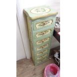 A 30cm wide modern decorative narrow chest with flight of seven drawers, with all round painted