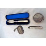 A cased silver ornate butter knife and folding fruit knife both with mother-of-pearl handles -