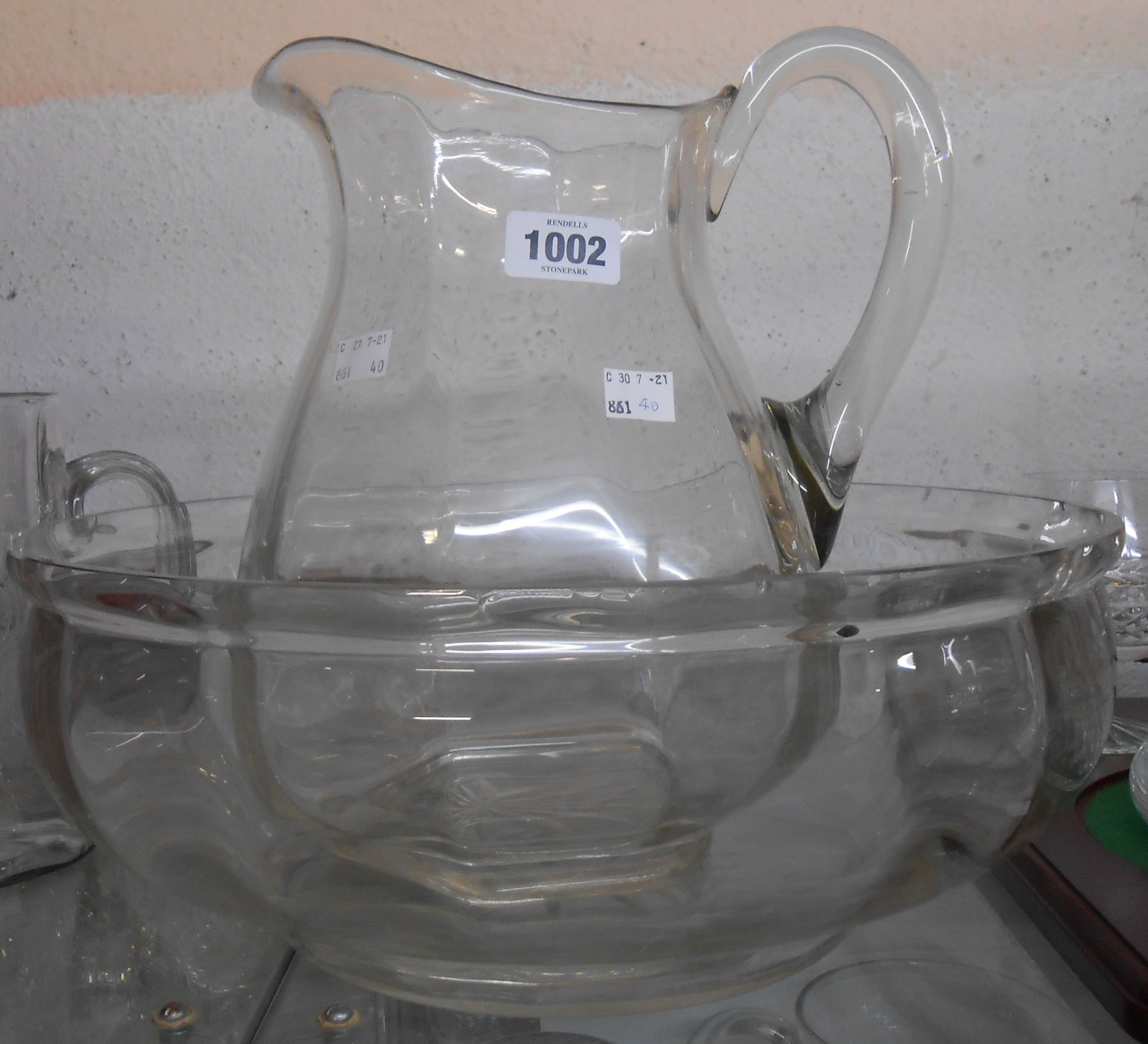 A large glass toilet jug and bowl