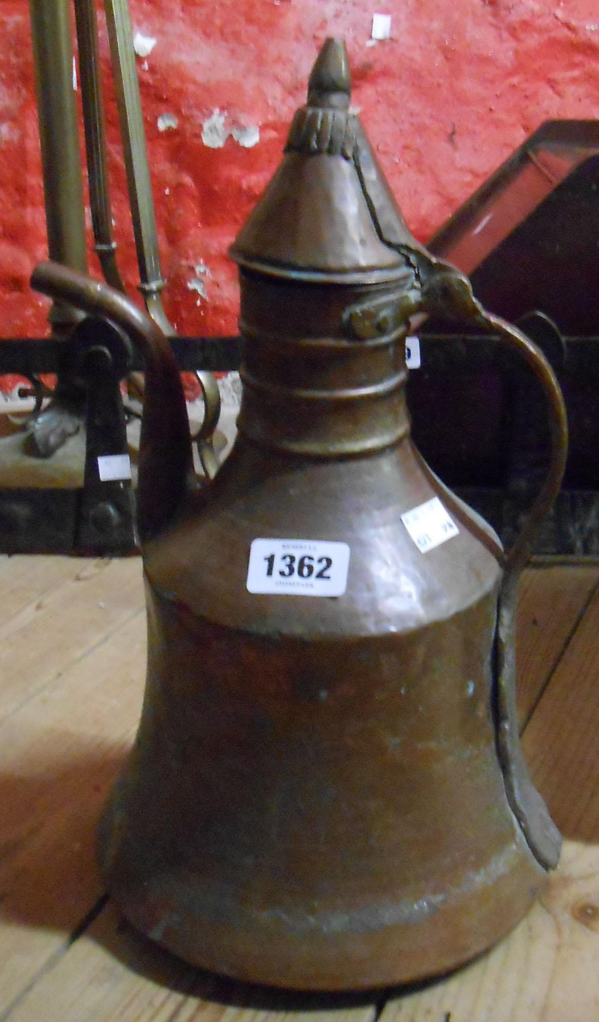 A Middle Eastern copper coffee pot