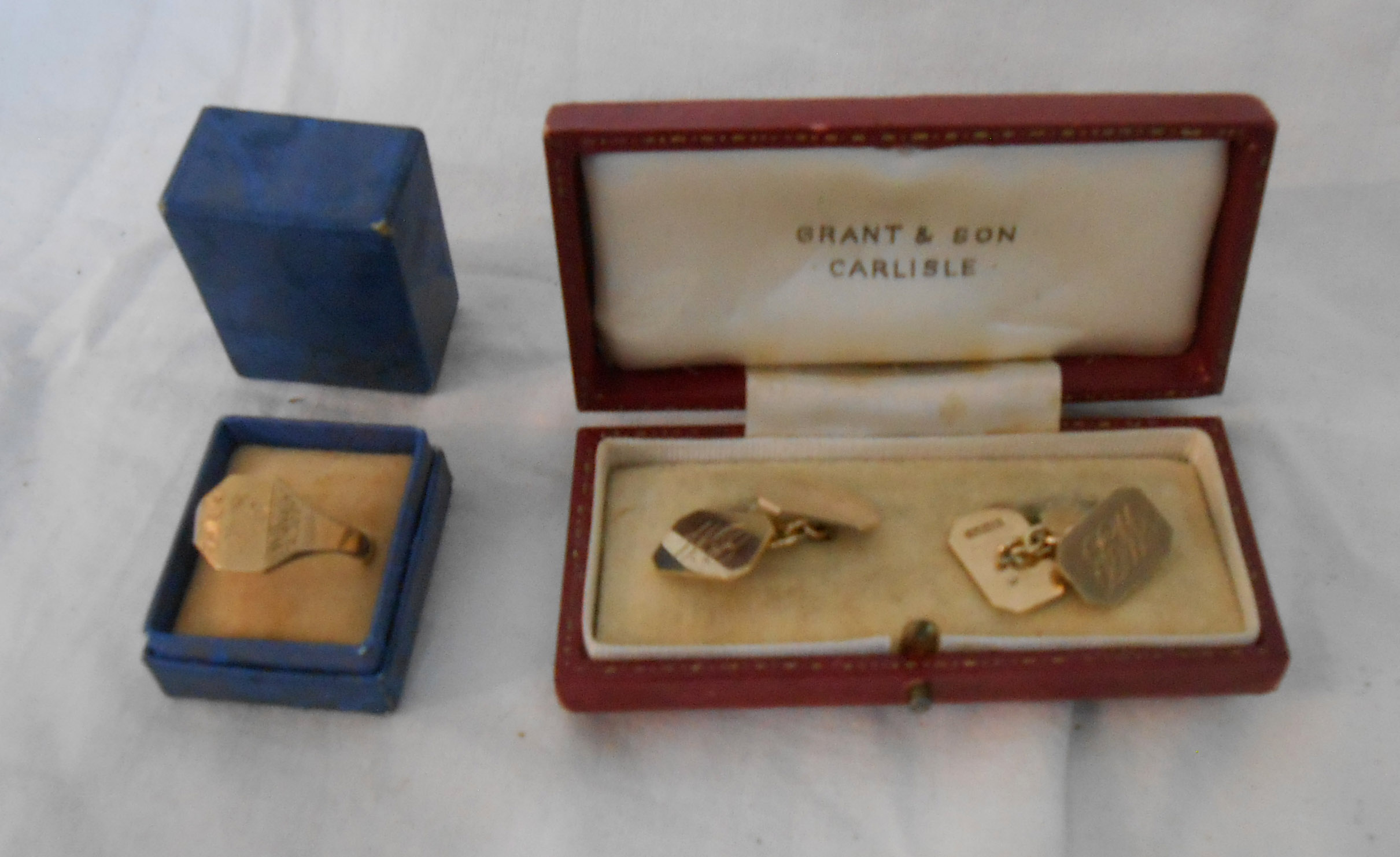 A boxed pair of 9ct. gold cuff-links with initials - sold with a 9ct. signet ring