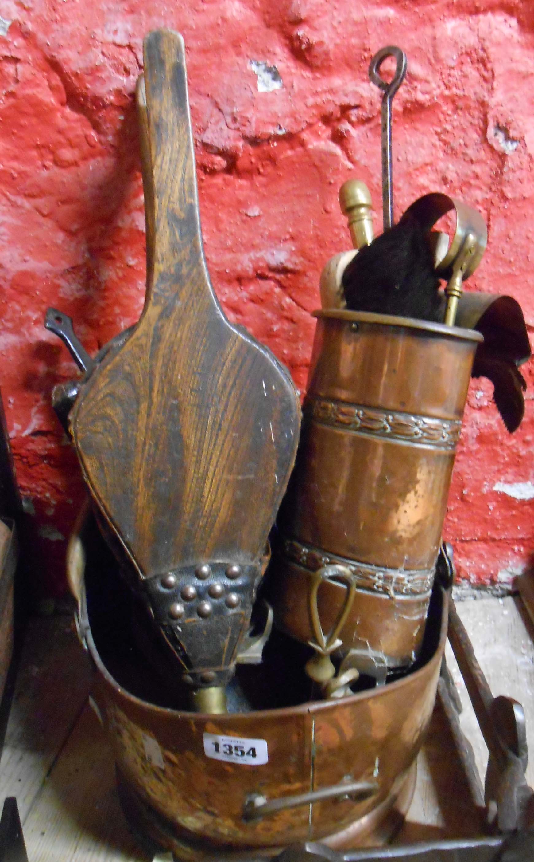 A copper helmet coal scuttle - sold with a part companion set, shovels and pair of wooden bellows