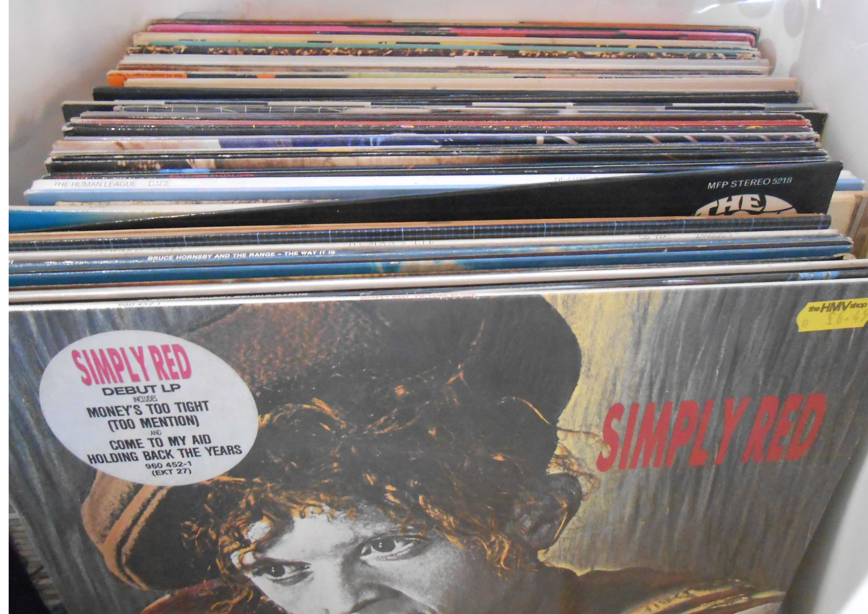 A bag containing assorted vinyl LPs including Ian Drury, Bruce Springsteen, U2, Blondie, Fleetwood