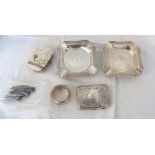 A pair of engine turned silver ashtrays bearing initials, cigarette case, napkin ring, purse and pen
