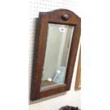 An early 20th Century polished oak framed wall mirror - sold with a smaller wall mirror with adapted
