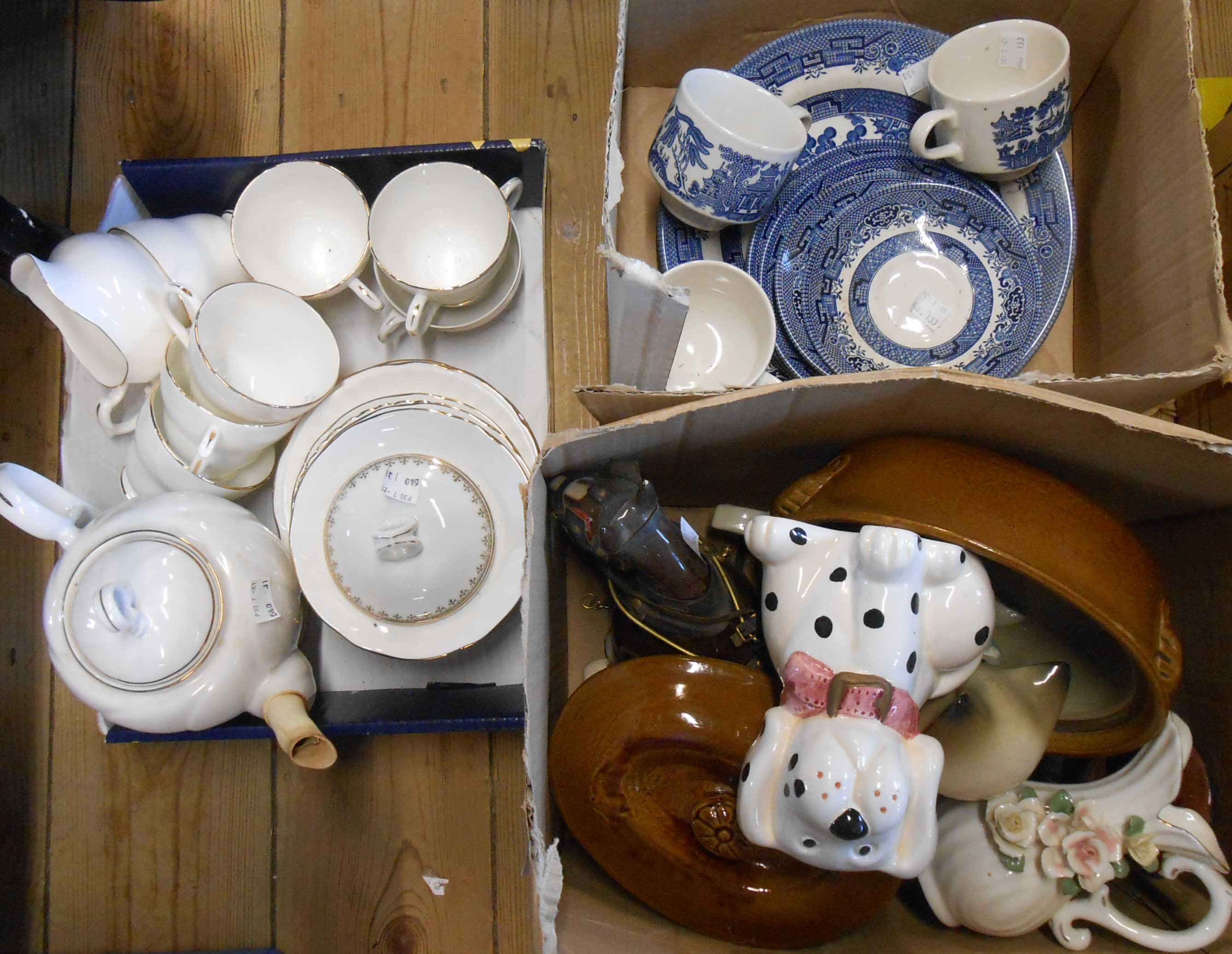 Three boxes containing assorted ceramics including part tea sets, horse figurine, etc.