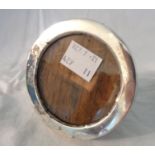 A small silver fronted circular photograph frame with oak easel back, by A.J. Pepper & Co. -
