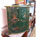 A 75cm modern chinoiserie wall hanging corner cabinet with raised painted and gilded figures in an
