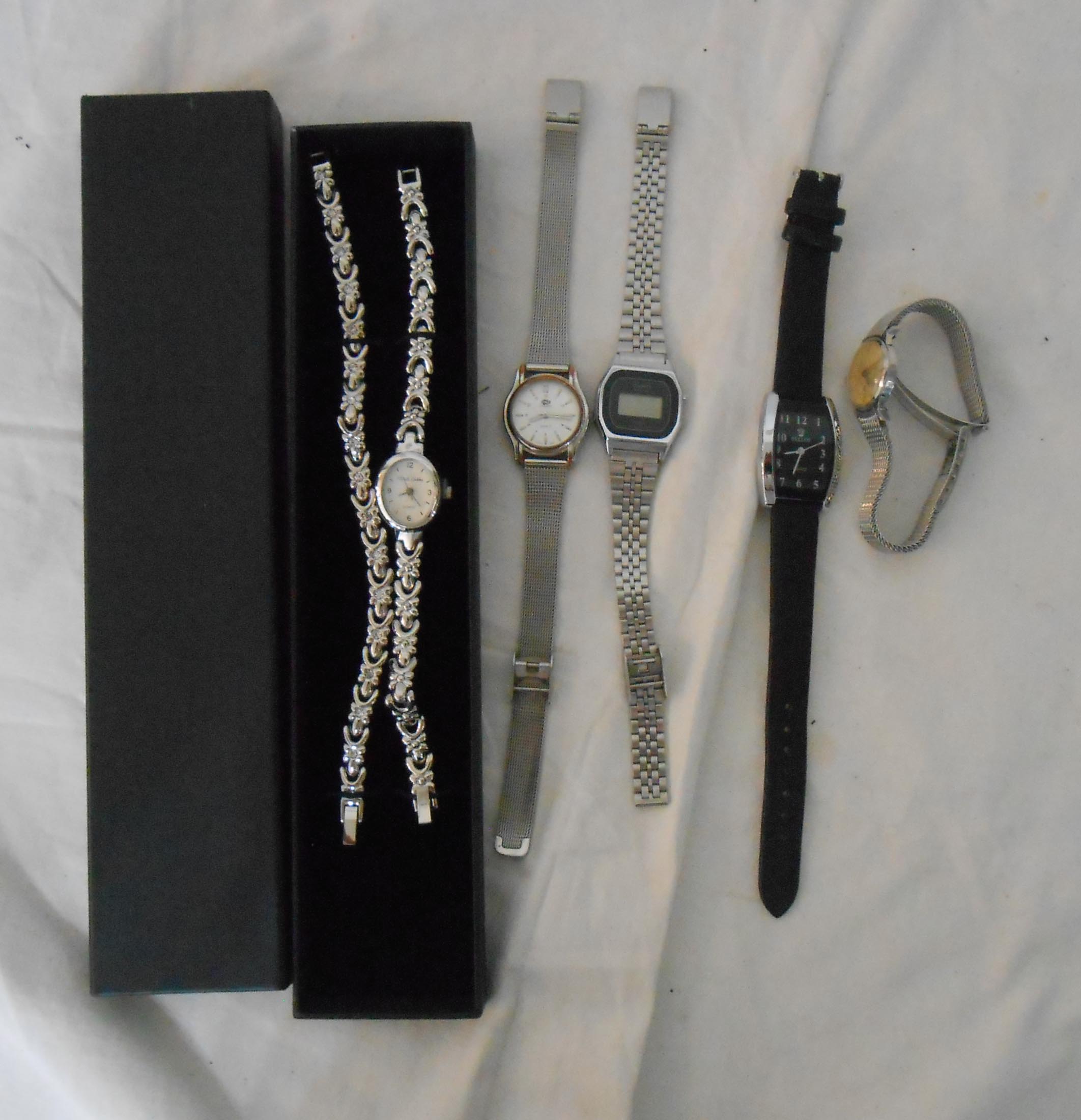 A vintage Omega steel cased lady's wristwatch, a Casio digital and two others, also a modern boxed