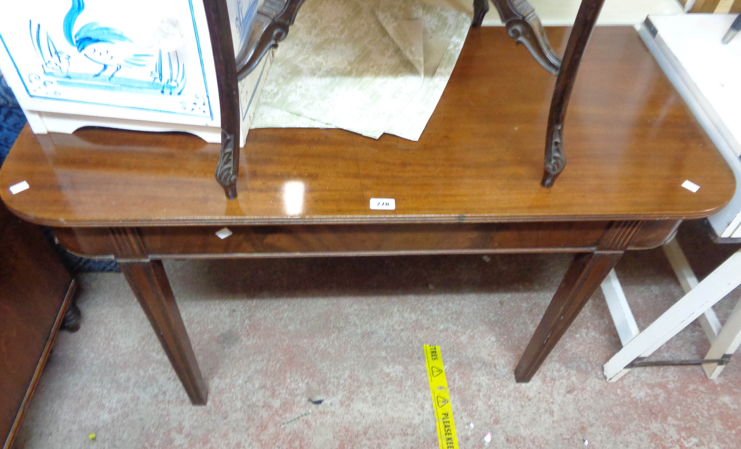 A 1.2m 19th Century mahogany side table, set on square tapered and reeded legs - some moulding loss