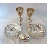 Two miniature silver goblets, a flip-top mustard pot and pair of small shell pattern dishes