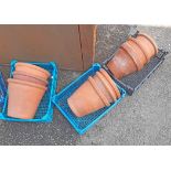 Three trays containing assorted medium size terracotta plant pots