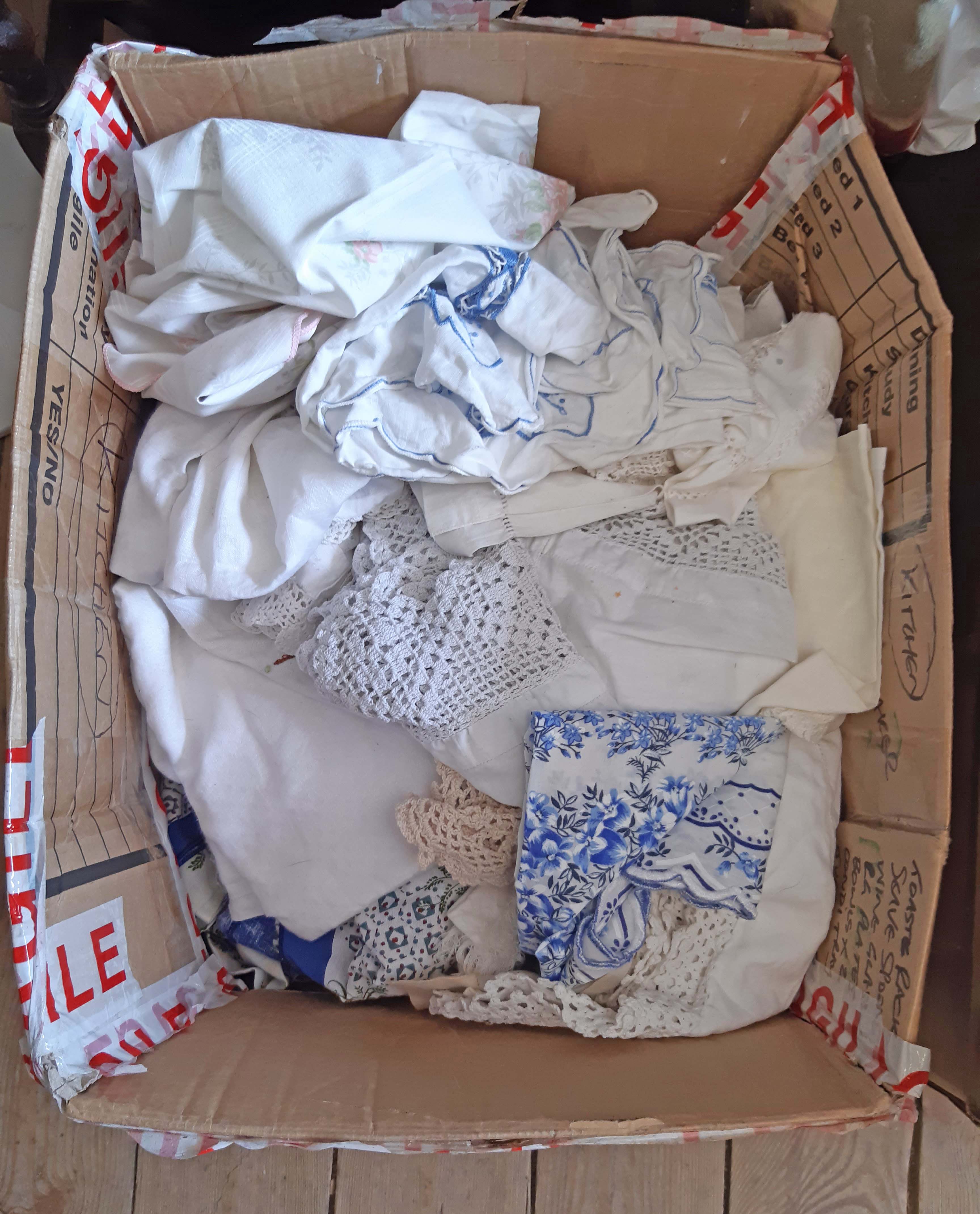 A box containing assorted linen