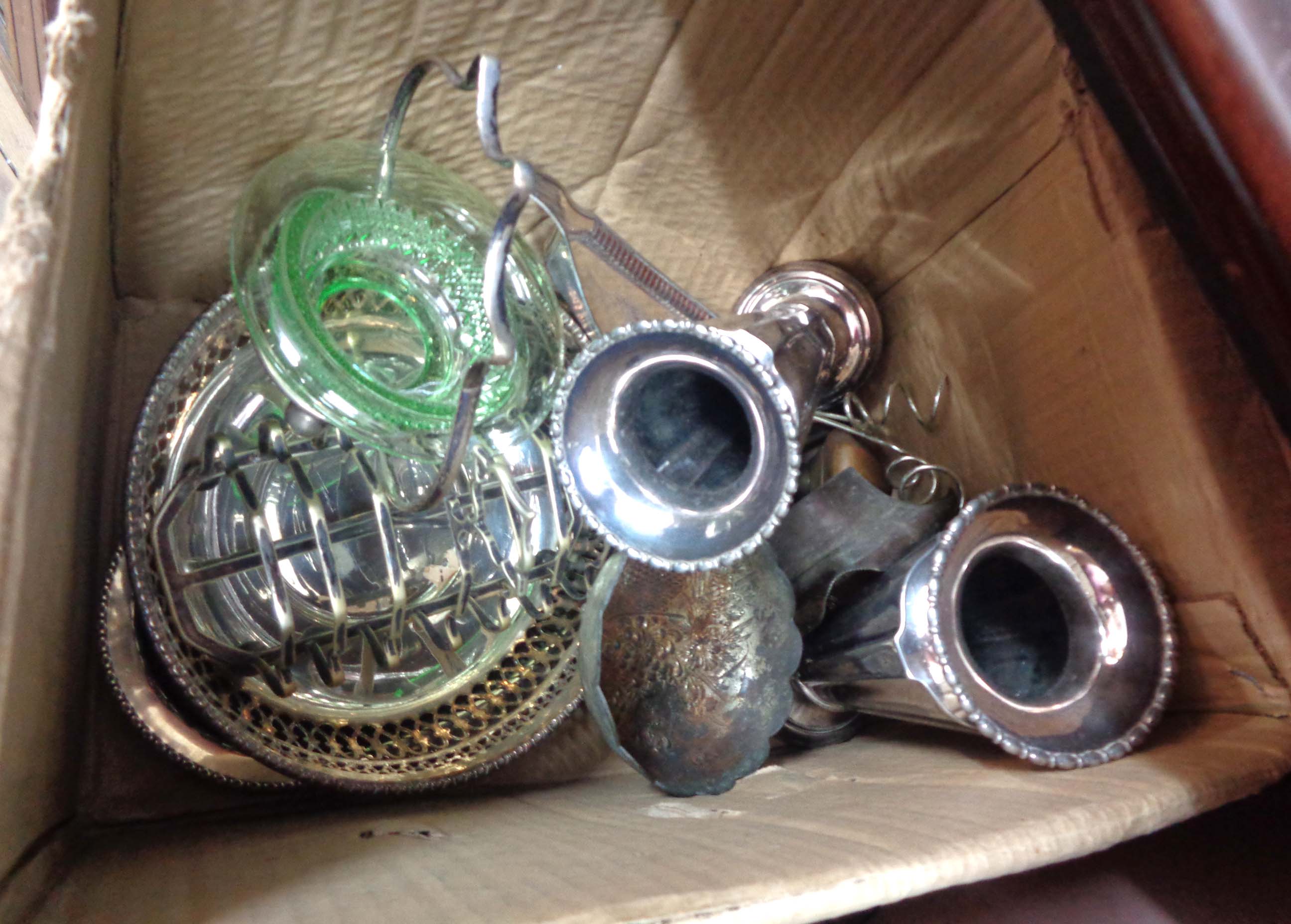 A box containing a quantity of silver plated items including a pair of faceted vases and cake