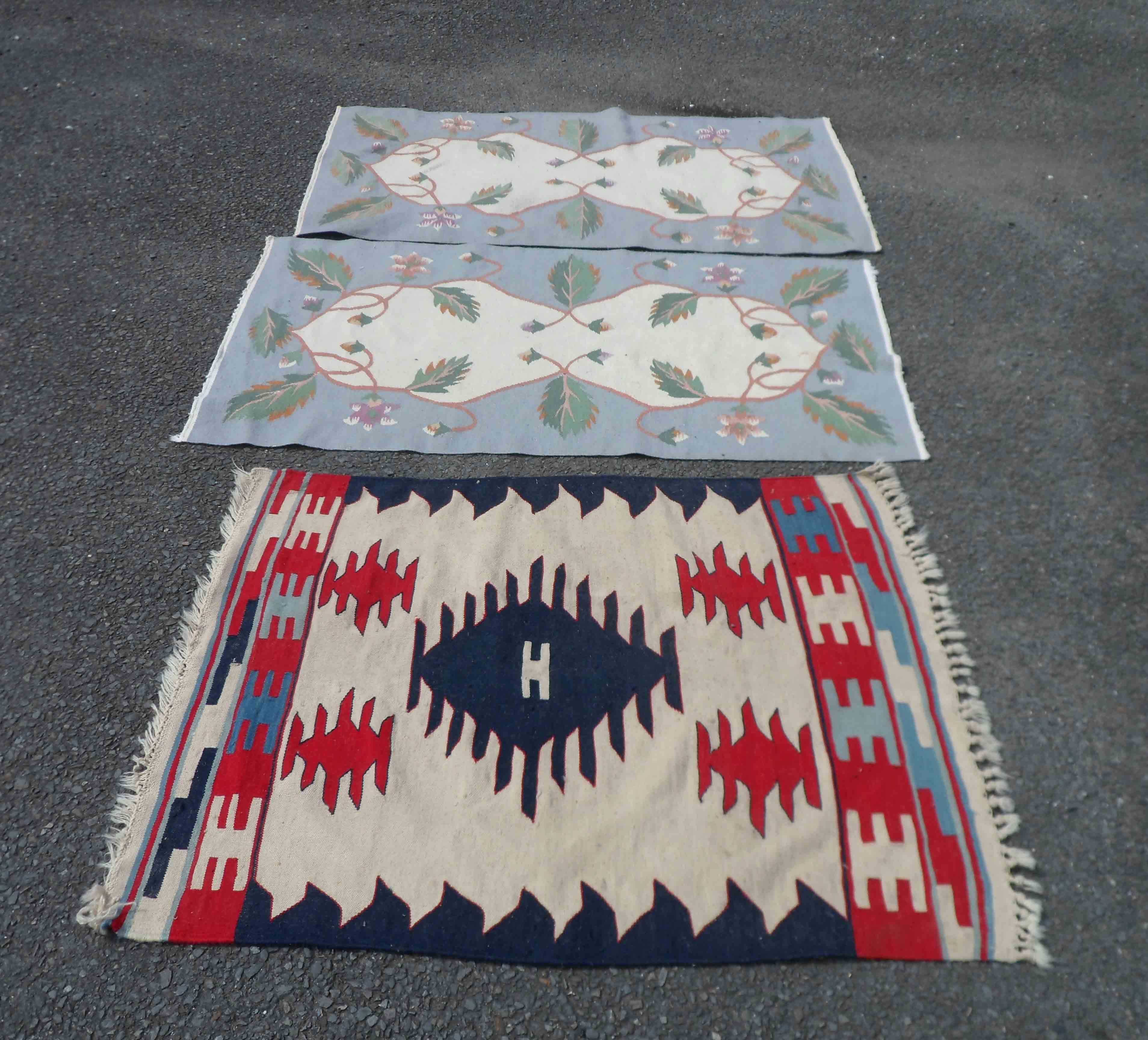 A 20th Century Pakistan kelim with repeat geometric designs on a cream ground - sold with two