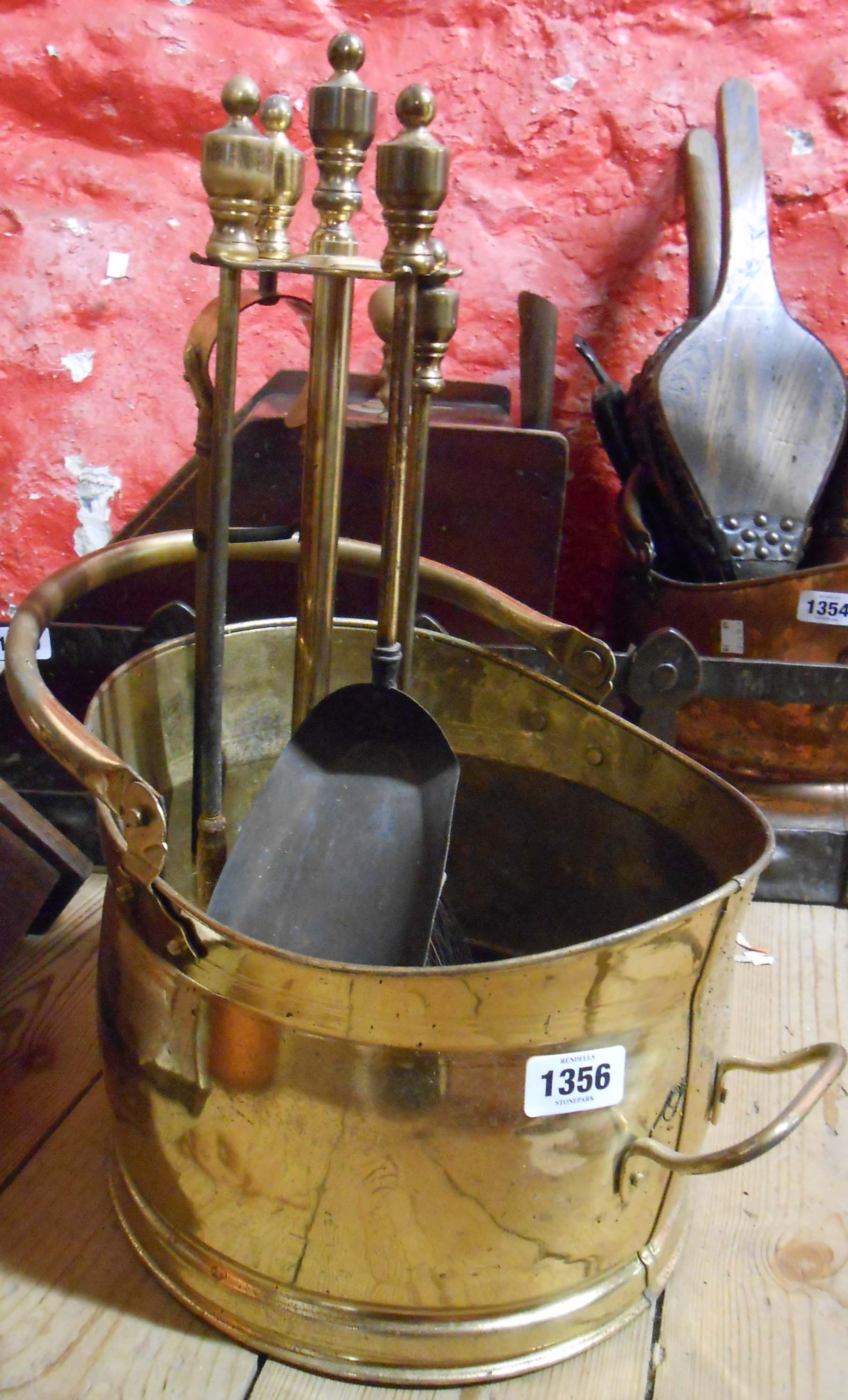 A brass helmet coal scuttle - sold with a companion set