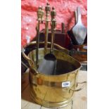 A brass helmet coal scuttle - sold with a companion set